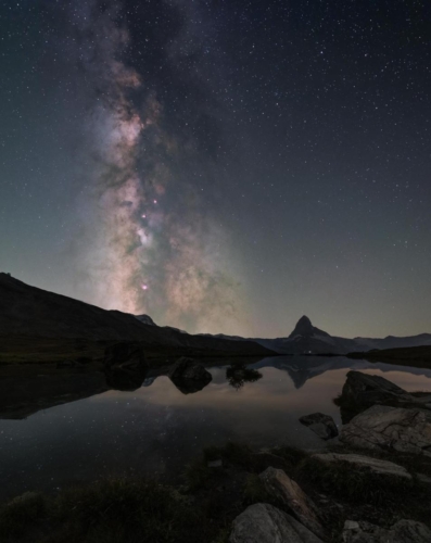 Milky Way next to the Matterhorn with reflection on Stellisee in Zermatt